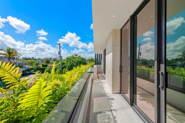 a view of a patio with a table and chairs
