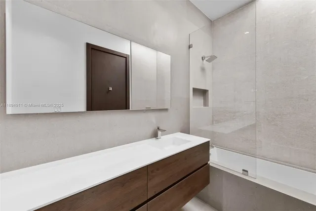 a view of a chairs and table in a backyard