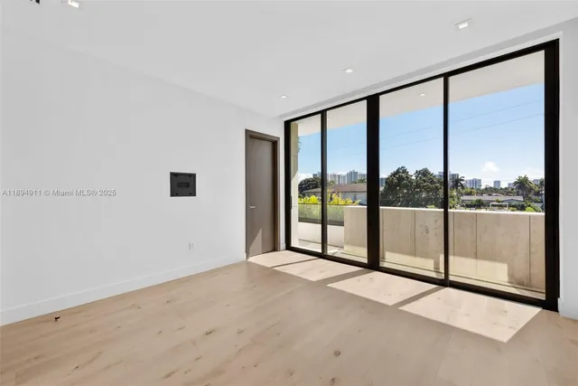 a lobby with furniture and potted plants