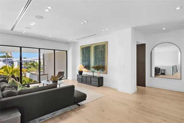 an aerial view of multiple houses with yard