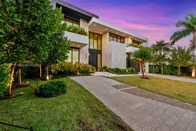 a view of a lake with a table and chairs
