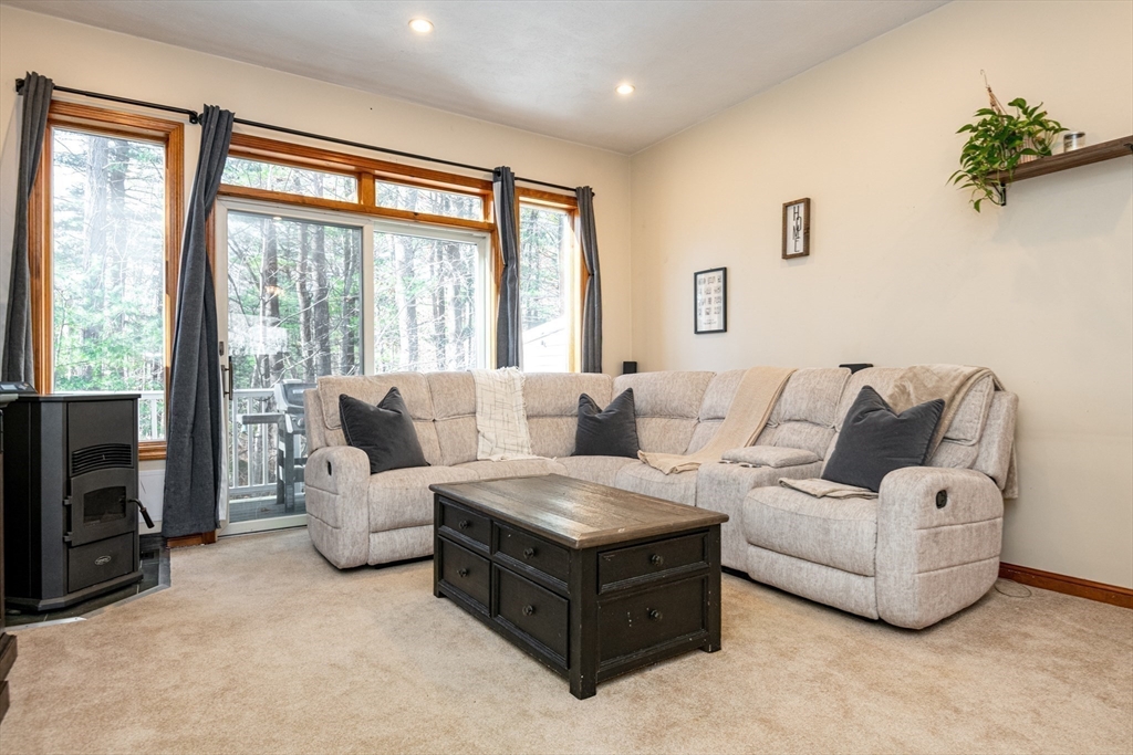 905 Sherwood Forest Lane, Unit 905 Saugus, MA 01906 - Photo 15 of 42 a living room with furniture and a large window