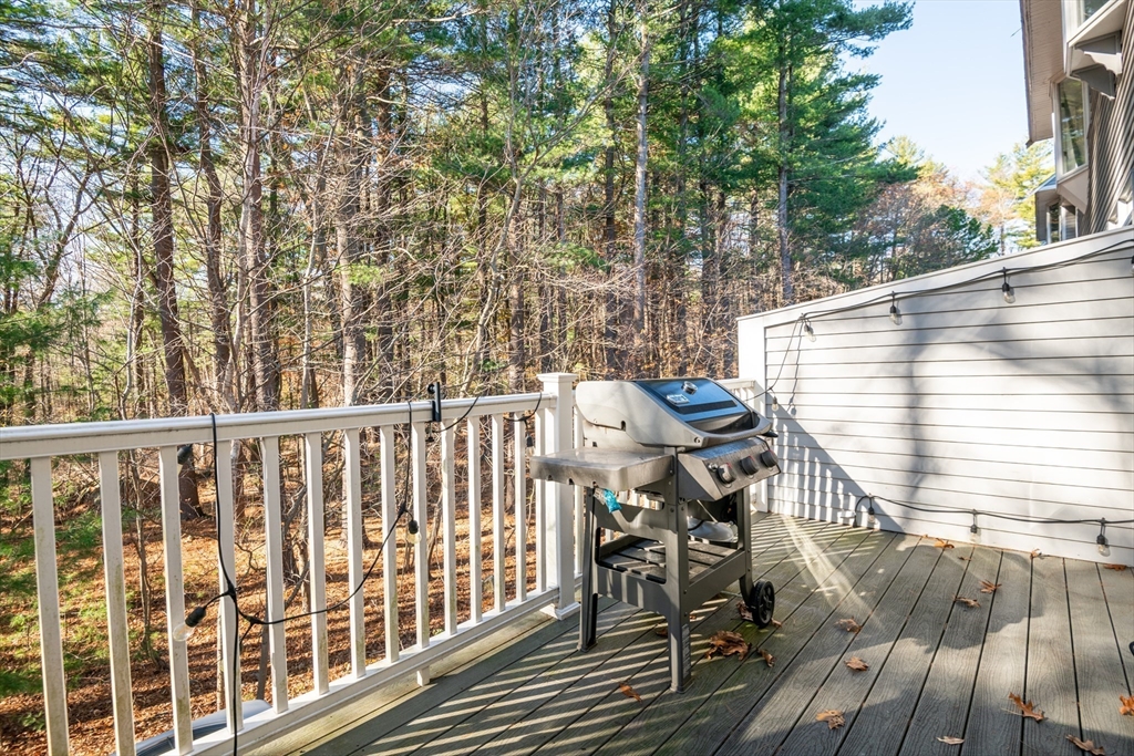 905 Sherwood Forest Lane, Unit 905 Saugus, MA 01906 - Photo 17 of 42 a view of balcony with wooden floor and outdoor seating