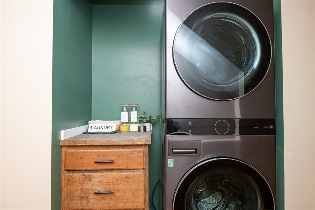 905 Sherwood Forest Lane, Unit 905 Saugus, MA 01906 - Photo 22 of 42 a utility room with dryer and washer