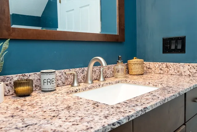 a kitchen with a sink and a stove top oven