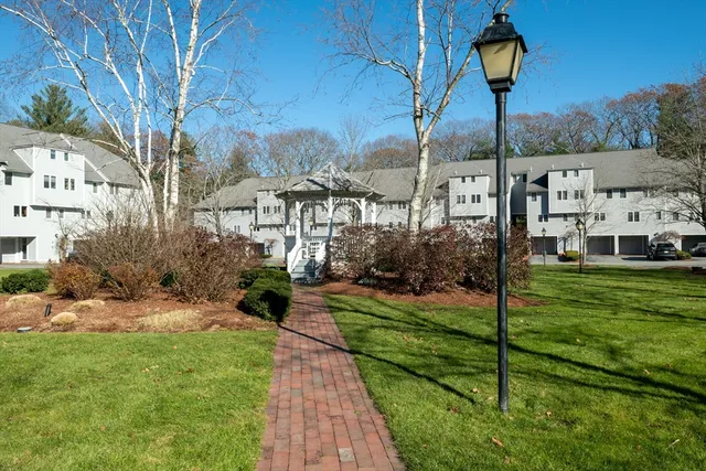 a view of a garden with a house