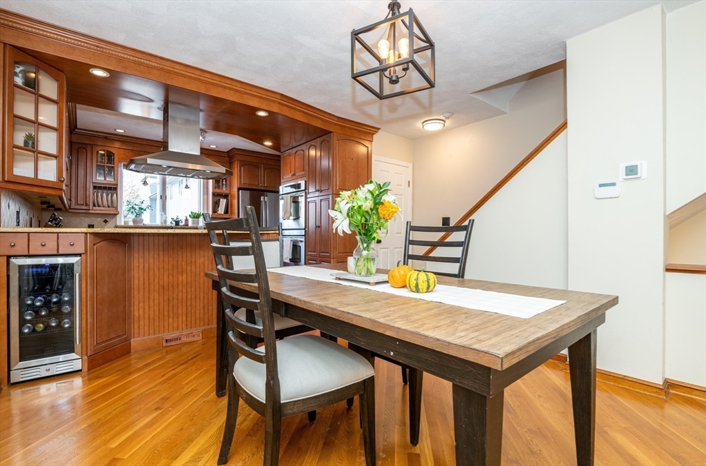 905 Sherwood Forest Lane, Unit 905 Saugus, MA 01906 - Photo 4 of 42 a view of a dining room with furniture and wooden floor