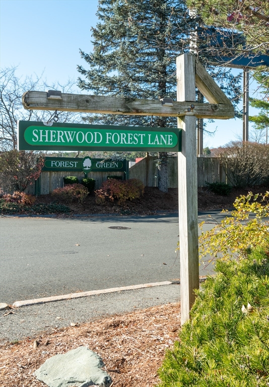 905 Sherwood Forest Lane, Unit 905 Saugus, MA 01906 - Photo 42 of 42 a view of a street with a sign on the side of the building