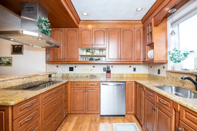 a kitchen with a sink stove and cabinets