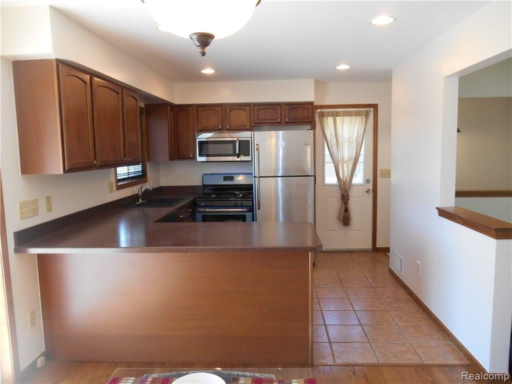 25754 Peter Kaltz Road Warren, MI 48091 - Photo 14 of 68 KITCHEN VIEW WITH SIDE DOOR ENTRY