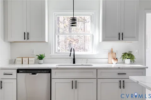 a kitchen with a sink and a window