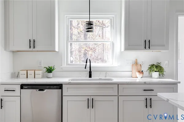 a kitchen with a sink and a window
