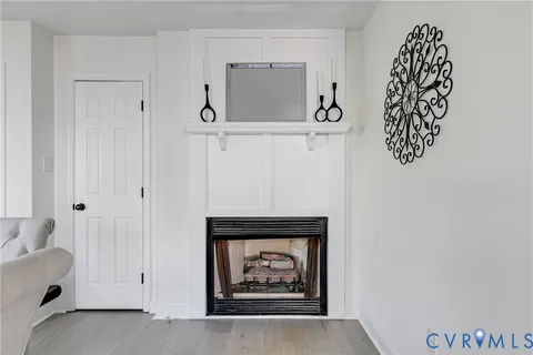 a view of an empty room with a hallway and stairs