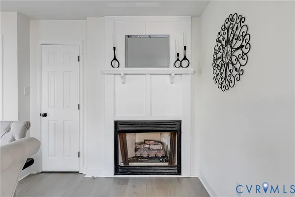 a view of an empty room with a hallway and stairs
