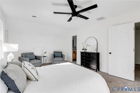 a bedroom with a bed and a dresser