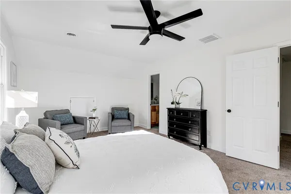 a bedroom with a bed and a dresser