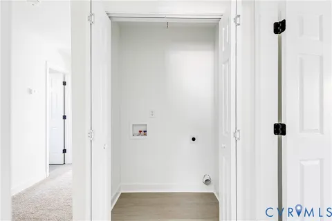 a view of a refrigerator in kitchen and window