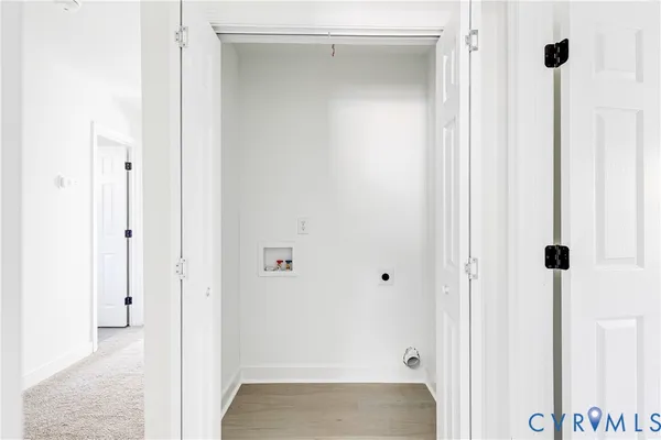 a view of a refrigerator in kitchen and window