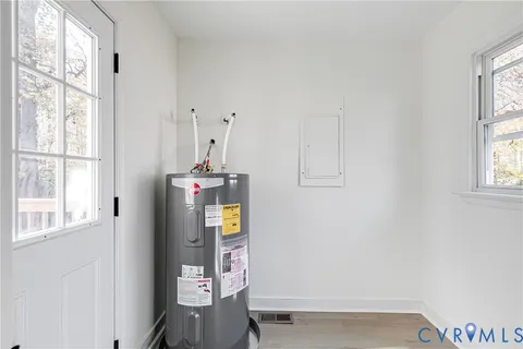 a view of a wooden balcony and trees