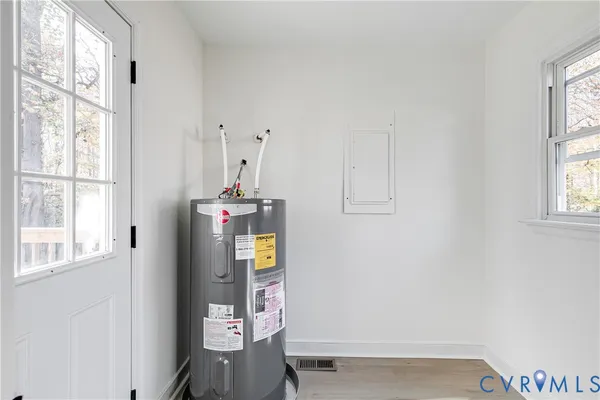 a view of a wooden balcony and trees