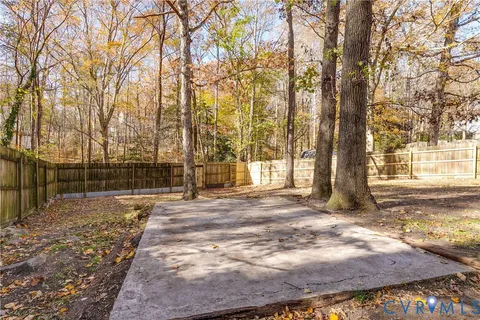a green field in front of the house