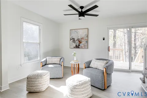 a living room with furniture and a window