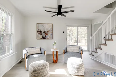 a living room with furniture and a window