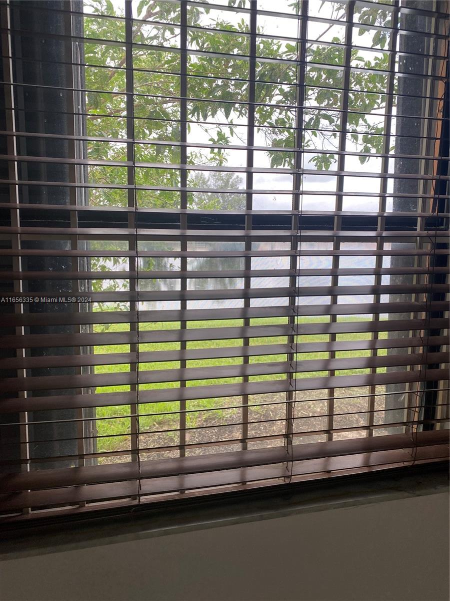 2460 West 67th Place, Unit 10127 Hialeah, FL 33016 - Photo 18 of 36 From the confort of your master bedroom you can view the lake. very peacefull.