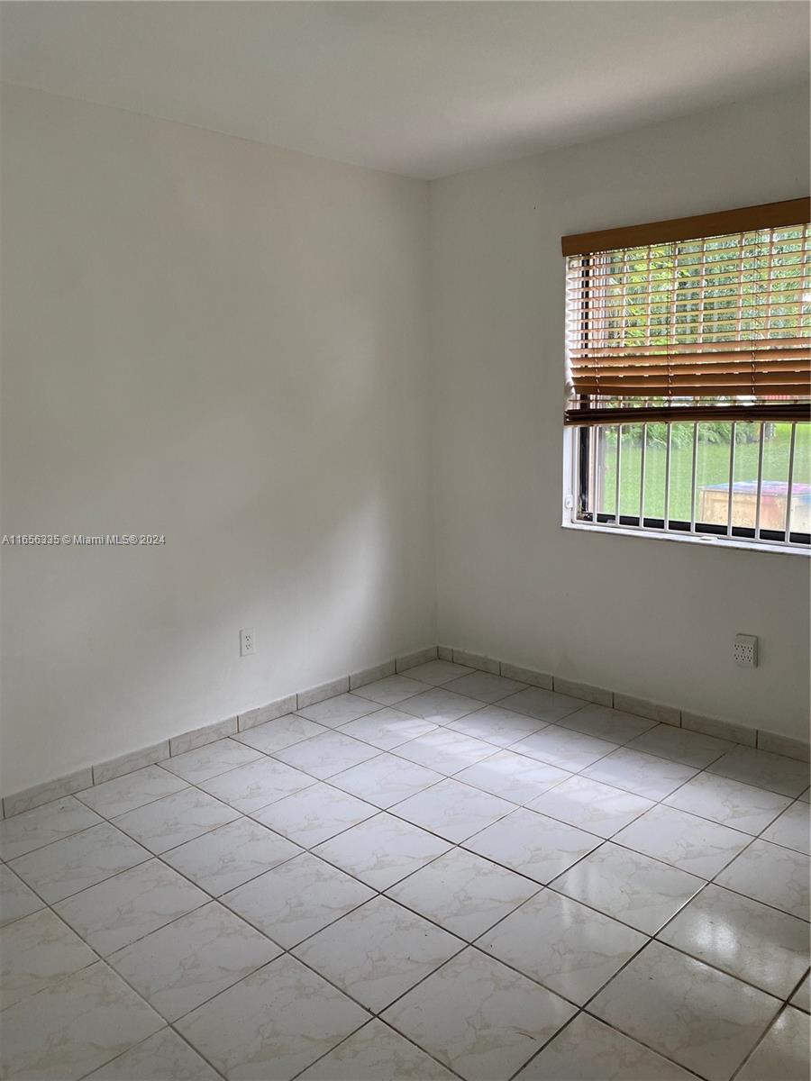 2460 West 67th Place, Unit 10127 Hialeah, FL 33016 - Photo 24 of 36 Second bedroom