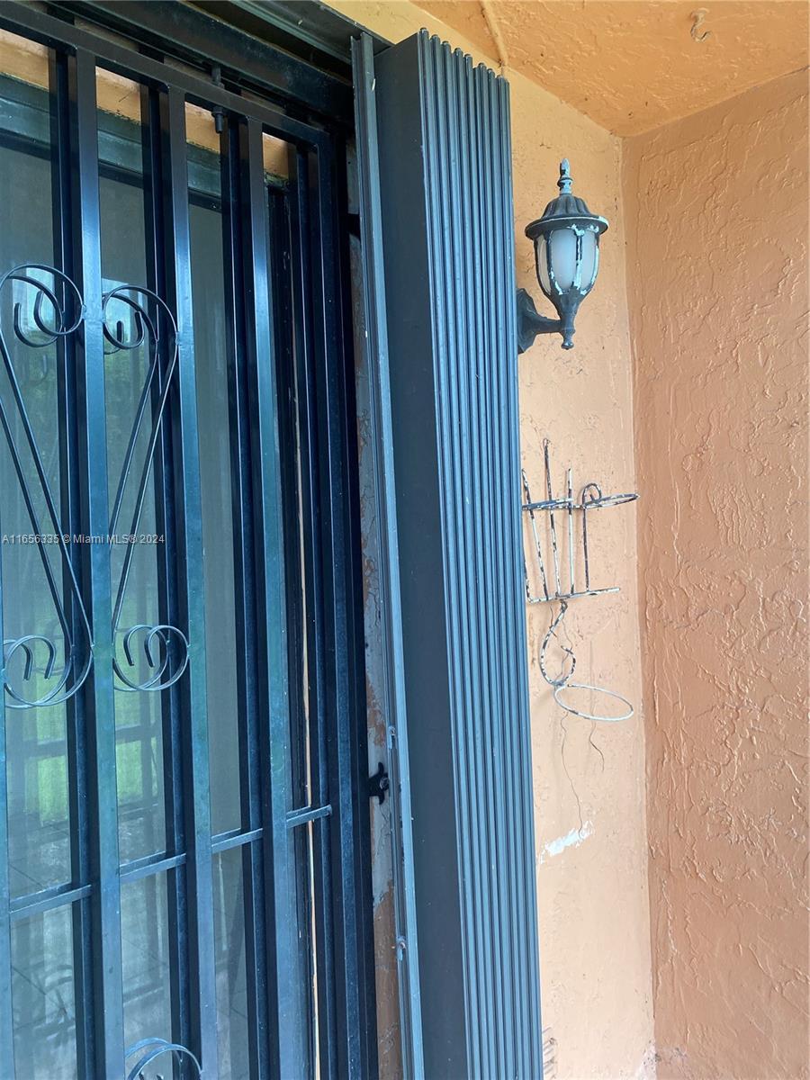 2460 West 67th Place, Unit 10127 Hialeah, FL 33016 - Photo 33 of 36 accordion shutters