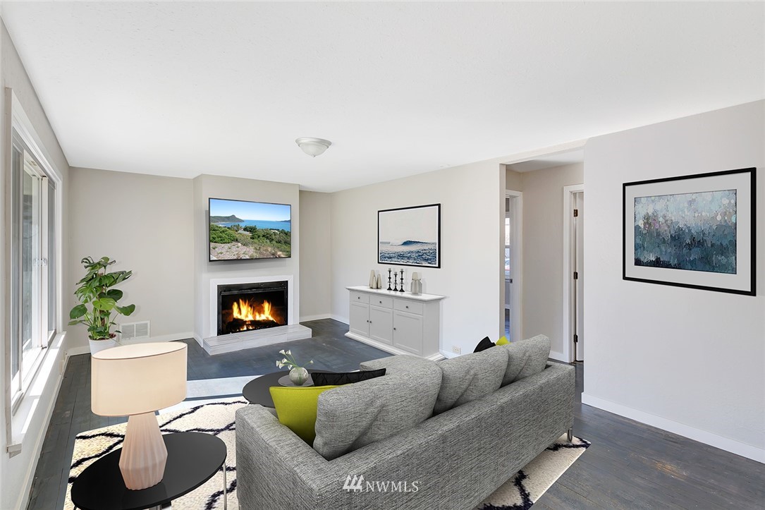 5300 Northeast 4th Street Renton, WA 98059 - Photo 2 of 12 a living room with furniture and a fireplace