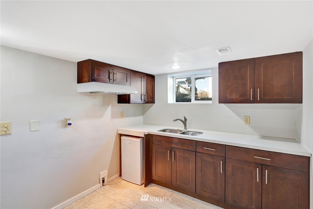 5300 Northeast 4th Street Renton, WA 98059 - Photo 11 of 12 a kitchen with a sink and cabinets