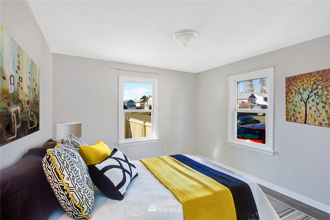 5300 Northeast 4th Street Renton, WA 98059 - Photo 5 of 12 a bedroom with a bed and a window