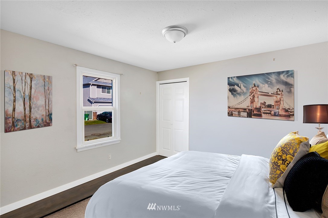 5300 Northeast 4th Street Renton, WA 98059 - Photo 6 of 12 a bedroom with a bed and a window