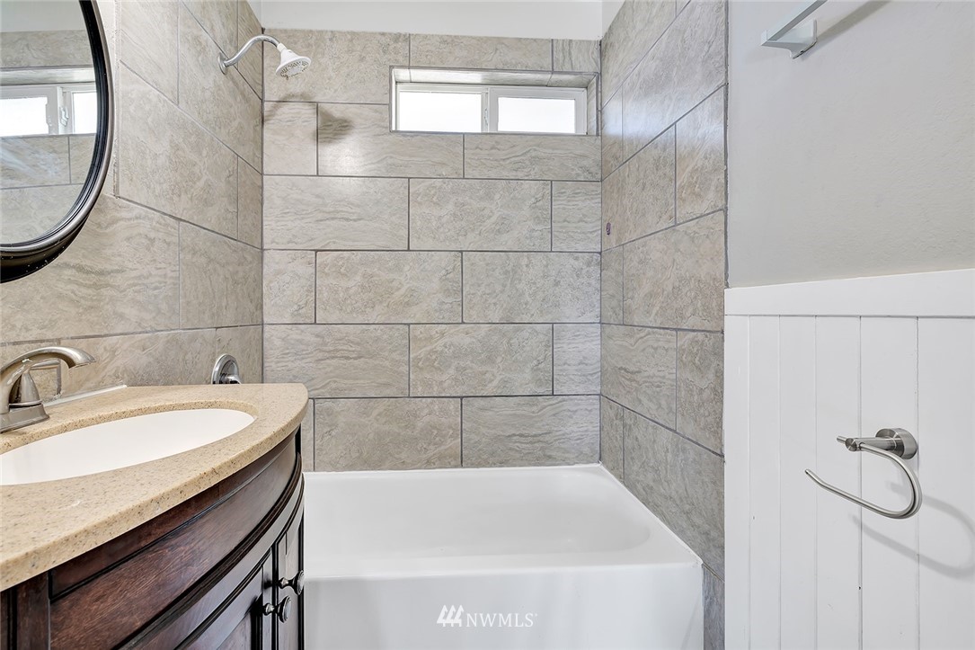 5300 Northeast 4th Street Renton, WA 98059 - Photo 7 of 12 a bathroom with a sink and a bathtub