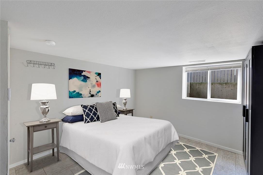 5300 Northeast 4th Street Renton, WA 98059 - Photo 8 of 12 a bedroom with a bed and a window