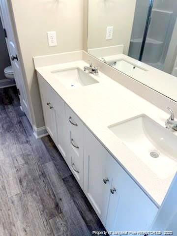 754 Walker (lot 1) Road Rockingham, NC 28379 - Photo 11 of 50 a bathroom with a double vanity sink and mirror
