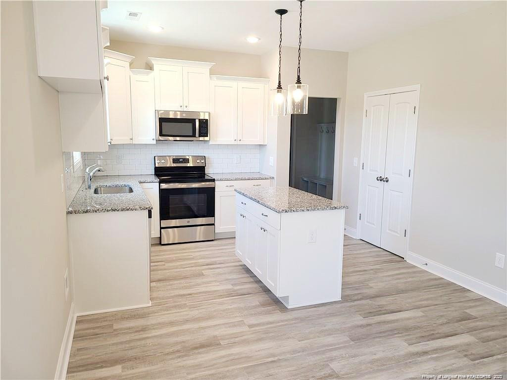 754 Walker (lot 1) Road Rockingham, NC 28379 - Photo 15 of 50 a kitchen with stainless steel appliances a refrigerator sink and stove