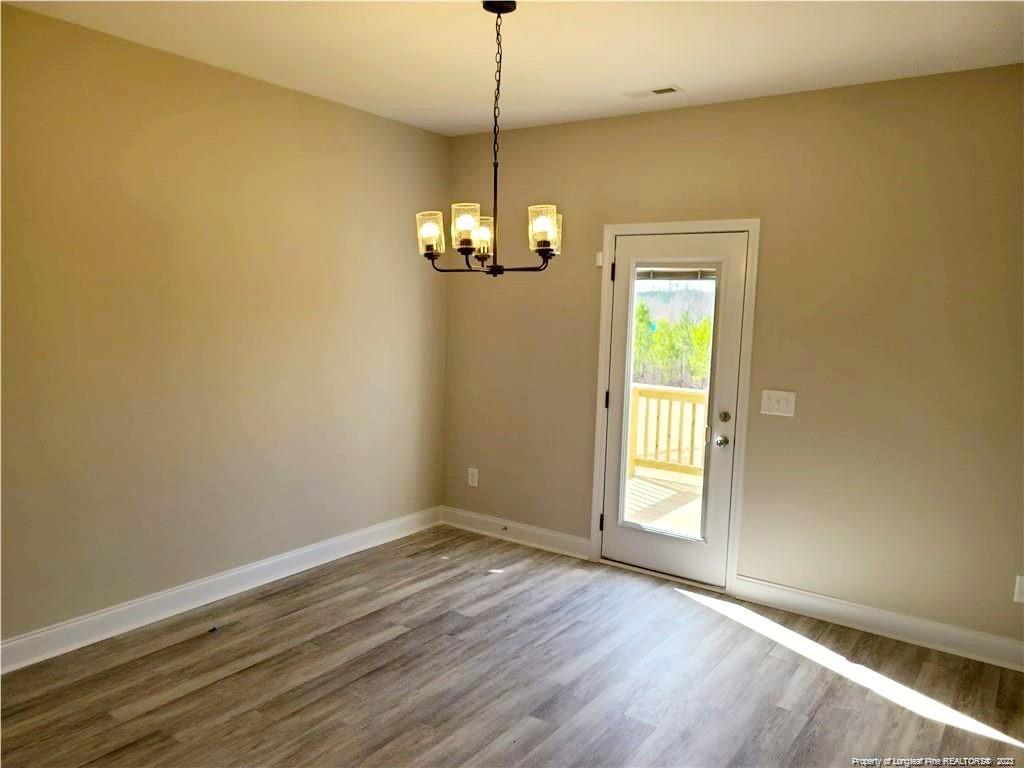 754 Walker (lot 1) Road Rockingham, NC 28379 - Photo 17 of 50 a view of empty room with wooden floor and fan