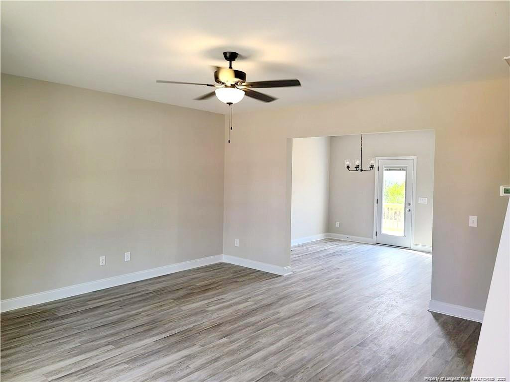 754 Walker (lot 1) Road Rockingham, NC 28379 - Photo 18 of 50 an empty room with wooden floor fan and windows