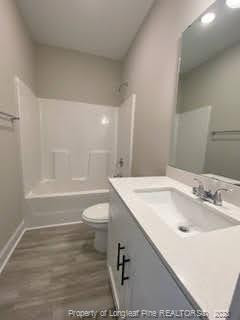 754 Walker (lot 1) Road Rockingham, NC 28379 - Photo 28 of 50 a bathroom with a sink toilet vanity and shower