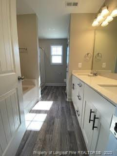 754 Walker (lot 1) Road Rockingham, NC 28379 - Photo 35 of 50 a bathroom with a sink a mirror and a shower