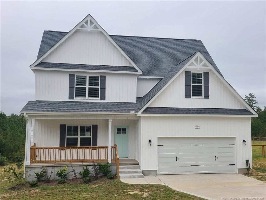 754 Walker (lot 1) Road Rockingham, NC 28379 - Photo 46 of 50 a front view of a house with garage