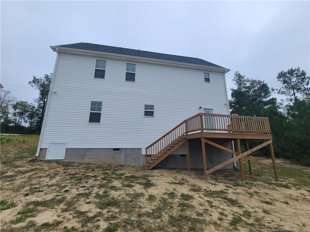 754 Walker (lot 1) Road Rockingham, NC 28379 - Photo 49 of 50 a house with trees in the background