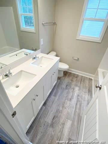 754 Walker (lot 1) Road Rockingham, NC 28379 - Photo 8 of 50 a bathroom with a sink mirror and a toilet