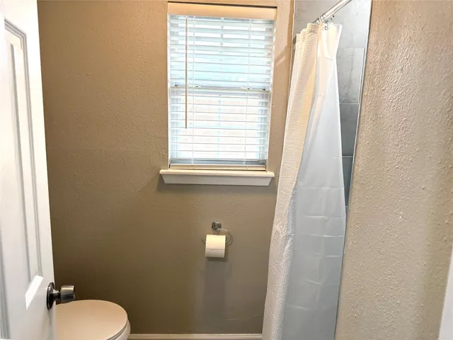 a bathroom with a toilet