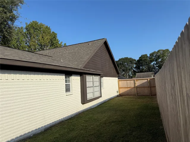 a backyard of a house with lots of green space