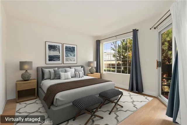 a bedroom with a large bed and a window