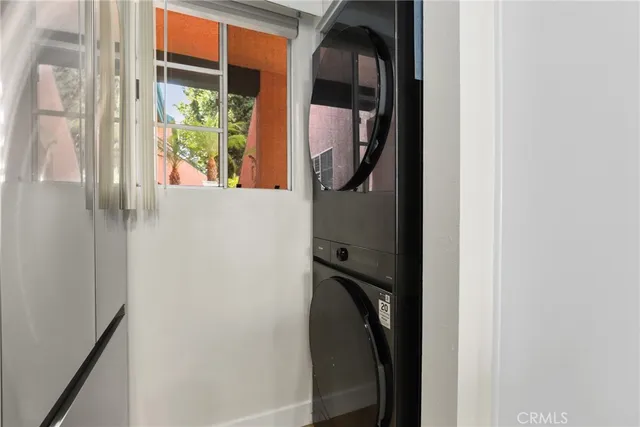 a close view of a utility room with dryer and washer