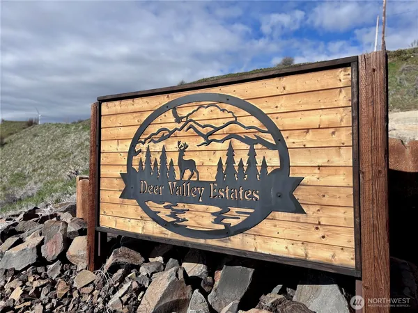 a view of a balcony with a table and chairs